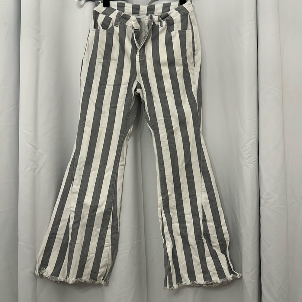 Gray and white striped denim pants with stars on the butt